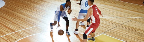 Youth playing basket ball